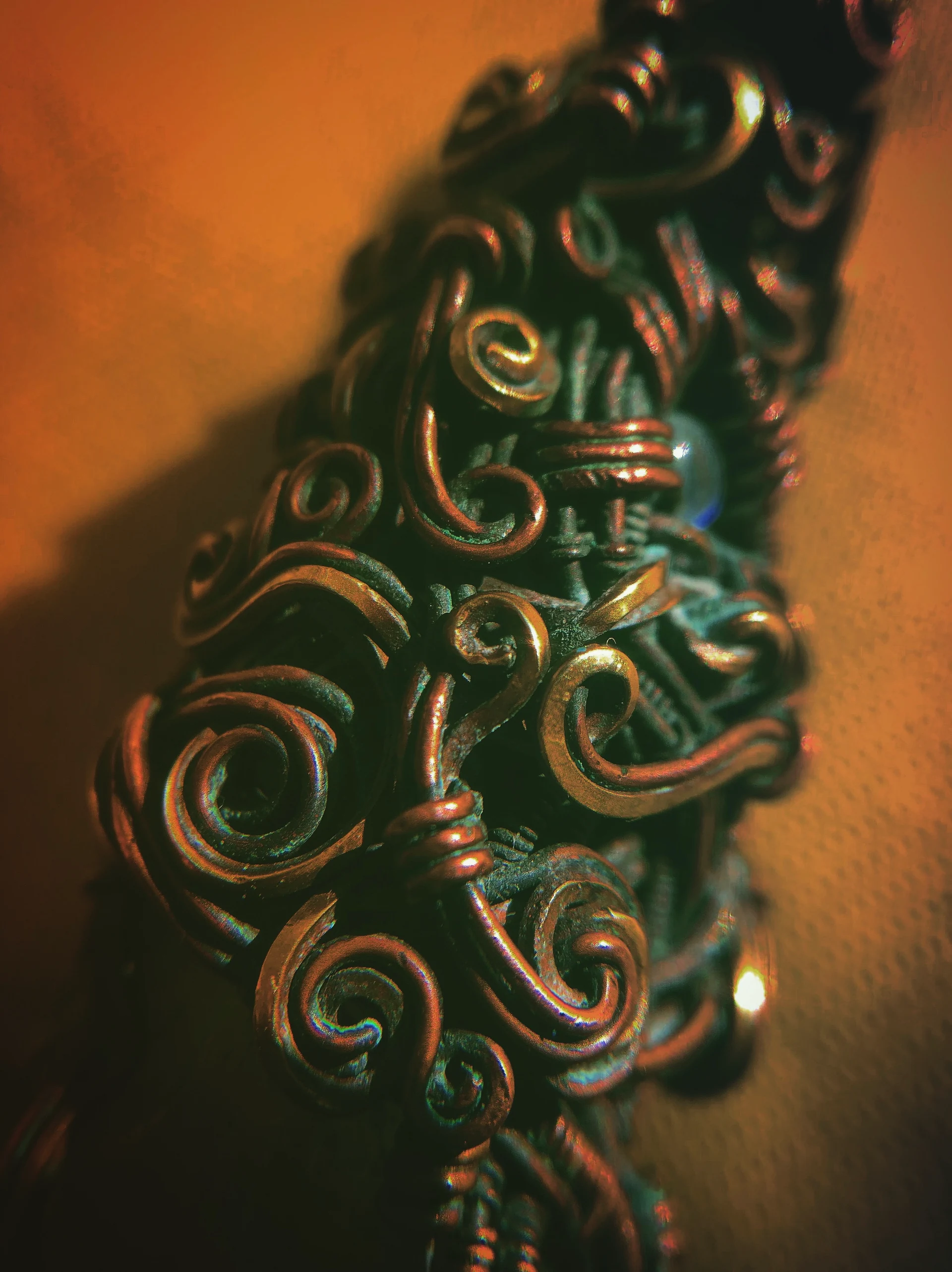 Warm-toned spirals and layered wire details